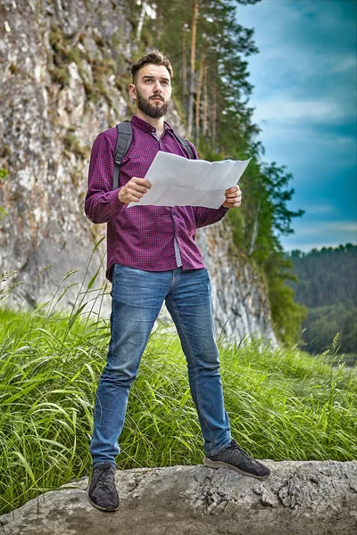 Young man travels in the wild.