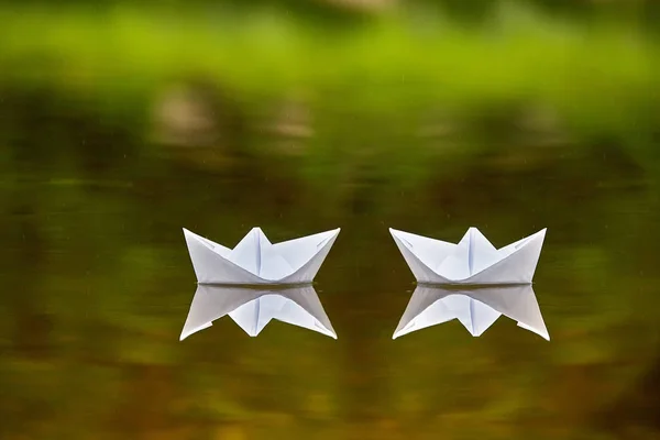 Concept picture of two paper boats.