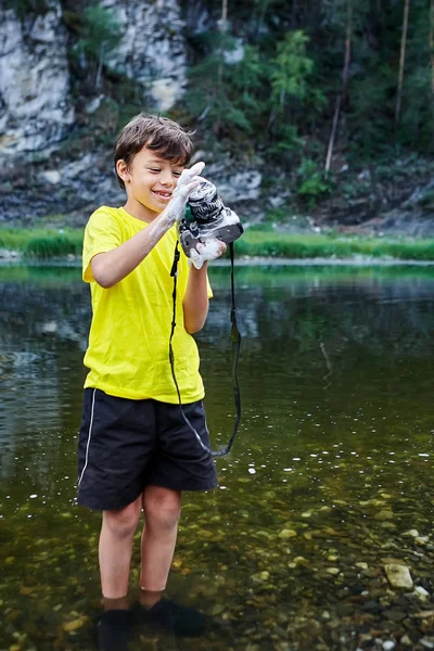 Naughty child ruined his parents camera. — Stock Photo, Image