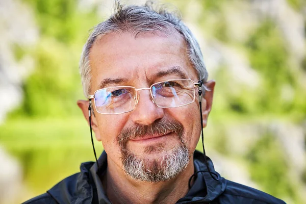 Smiling intellectual with glasses and a beard. — Stock Photo, Image