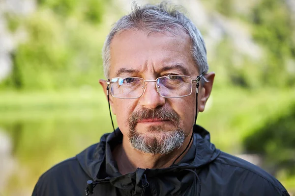 Serious mature man with glasses. — Stock Photo, Image