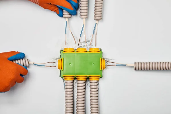 stock image Installing of a plastic electrical panel in home.