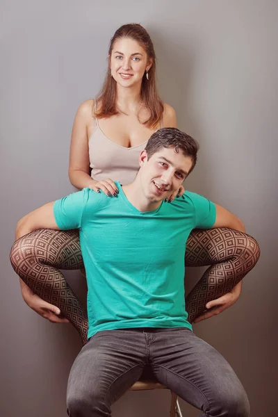 Smiling Young People Sitting Together Same Chair White Man Woman — Stock Photo, Image