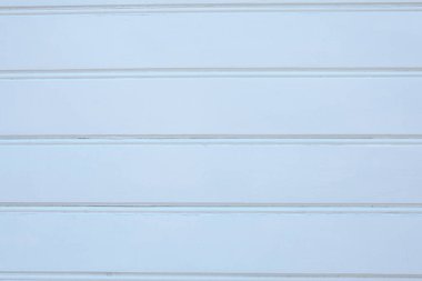 Tahtalarla kaplı beyaz bir duvarın ahşap dokusu. Boyalı ahşap yüzey, düşük kontrastlı, tasarım kullanımı için arkaplan resmi.