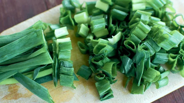 Green onion - a feather representing onion leaves. Chopped green onions.