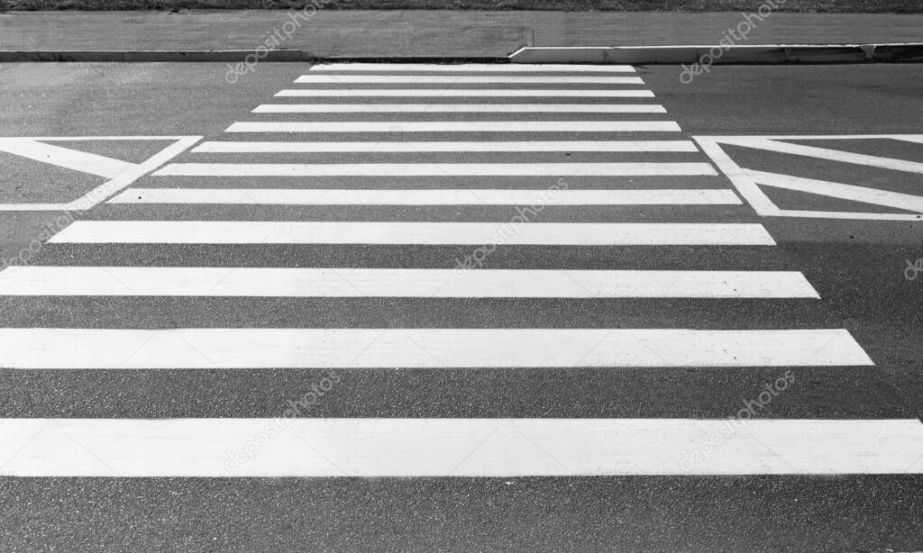 Background in the form of road markings of a pedestrian crossing