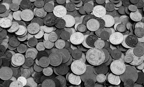 stock image Background in the form of a layer of old coins of different countries