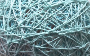 Pamuk iplik doku ile mavi arka plan. yün veya pamuk iplik bir top haline yara örme için