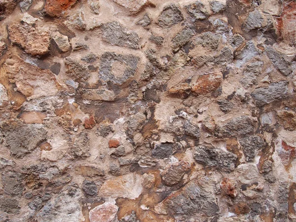 Antigo Resistiu Irregular Marrom Áspero Pedra Parede Fundo Com Cimento — Fotografia de Stock
