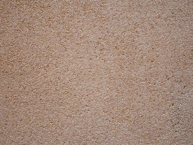 sarı kahverengi ve beyaz tonlarında pürüzsüz ezilmiş granit çakıl dokulu duvar veya zemin yüzeyi arka plan