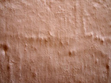 boya fırçası ile kaba bir engebeli pişmiş toprak renkli çimento duvar arka plan doku işaretleri