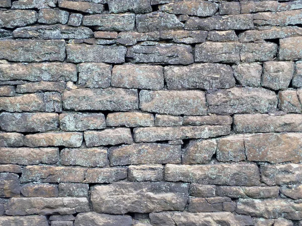 Velho áspero parede de pedra cinza — Fotografia de Stock