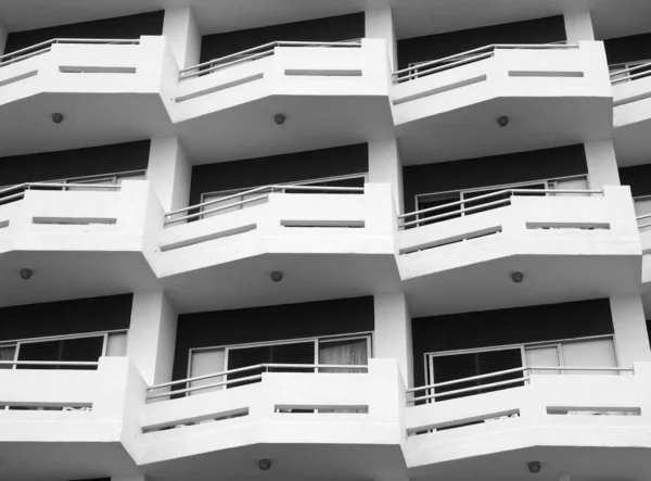 Modern apartments with geometric white balconies with angular railings — Stock Photo, Image