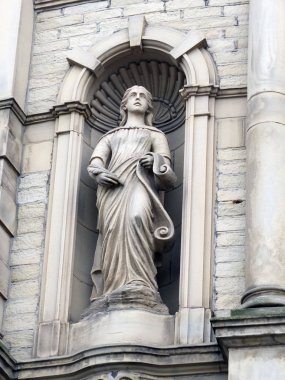 statue of a muse on a victorian theater building in Halifax Engl clipart