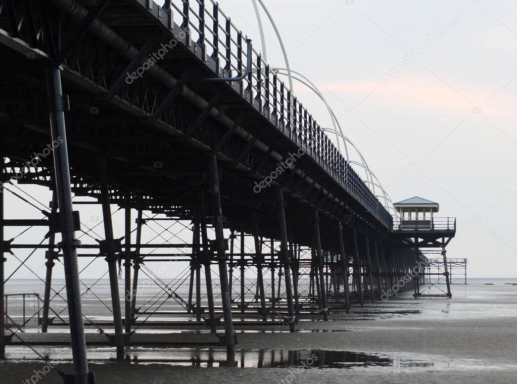 southport pier showing beach and structure in the evening