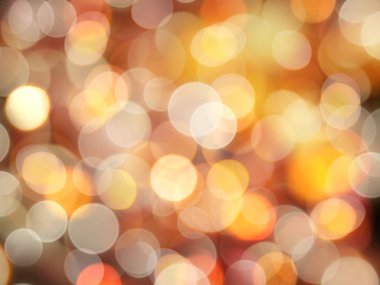 Altın turuncu ve beyaz parlayan yuvarlak bulanık ışıkları ile vibran