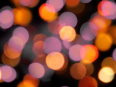 parlayan yuvarlak turuncu ve mor parlayan yuvarlak bulanık ışıklar Bac