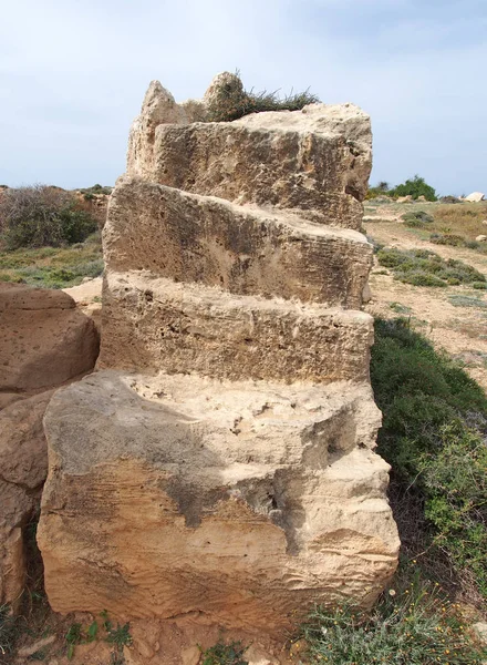exposed carved stone tomb with steps in the tomb of the kings area in paphos cyprus
