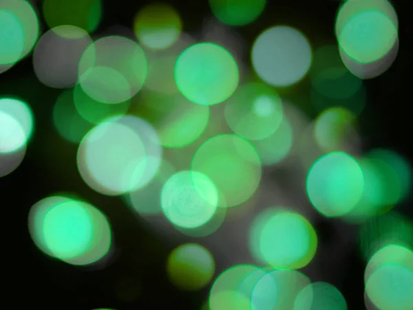 Verde redondo brillante luz brillante luces abstractas en una espalda negra — Foto de Stock