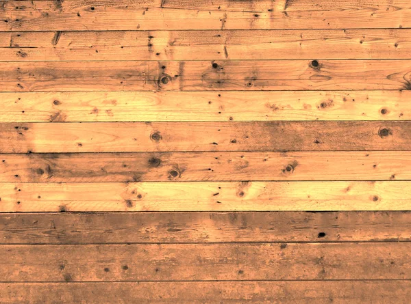 Marrón manchado viejo rústico tablón de madera pared o piso con algunas de las tablas hechas de madera reutilizada — Foto de Stock