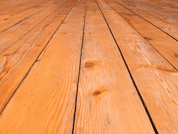 A full frame perspective view of old worn timber planking with a grainy textured surface used for flooring Royalty Free Stock Photos