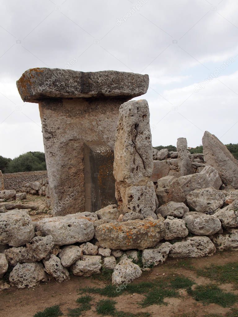 Talaiot de Trepuco megalithic t-shaped Taula monument in sunny day it Menorca SpainTalaiot de Trepuco megalithic t-shaped Taula monument and standing stone in Menorca Spain