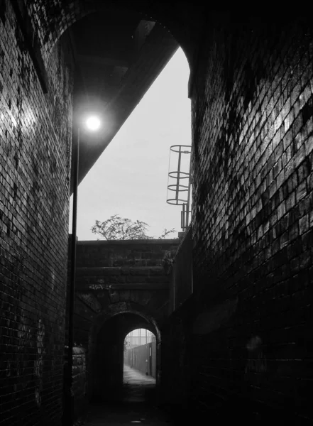 old brick arch, black and white