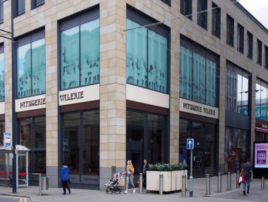 pedestrians on the broadway shopping area in bradford walking past a patisserie valerie closed after the business collapsed earlier in the year