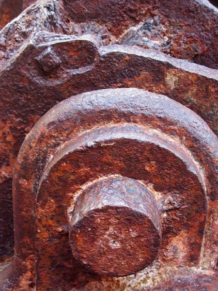 A close up of an axle and pieces on old rusted abandoned industrial machinery — Stock Photo, Image