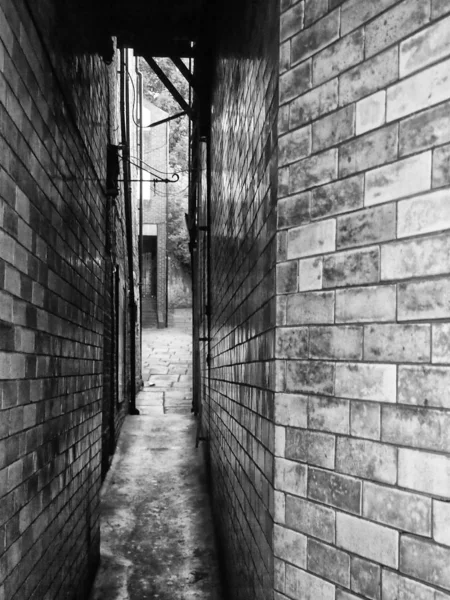 Monochrome Image Narrow Passage Two Brick Buildings — Foto de Stock