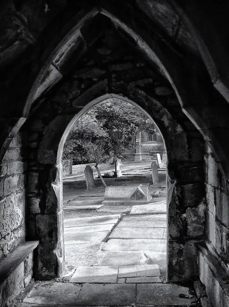 Church doorway and graveyard — Stock Photo, Image