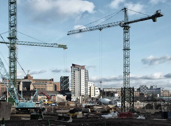 Large urban development construction site in Leeds with cranes m