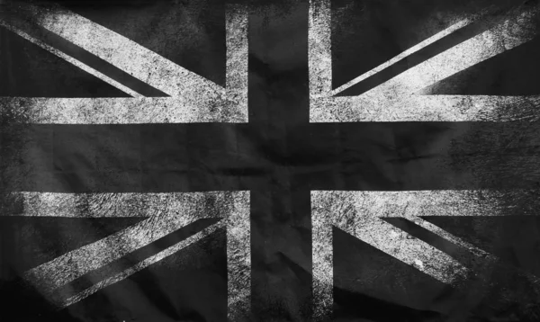 Ein monochromes Vollformat-Bild einer alten schmutzigen Union Jack britischen Flagge mit dunklen zerknitterten Kanten — Stockfoto