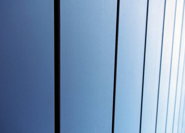 Modern textured metallic blue vertical panels architectural abstract background