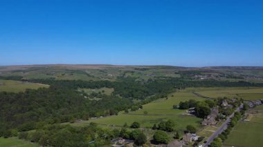 Viewing lush green landscape under clear sky