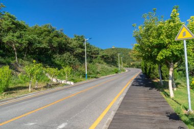 The scenery of Dalian Coastal Road in late Summer clipart