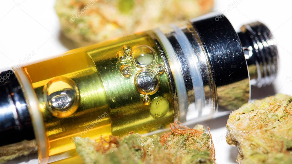 Vape, vaping cannabis oil for THC and CBD and marijuana bud 
