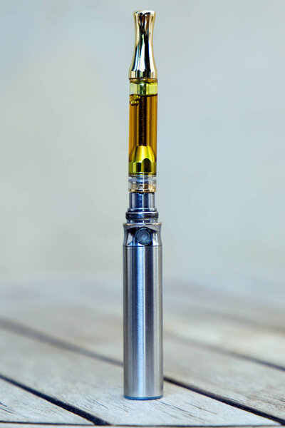 Vape Pen. Cannabis Oil. Vaping Marijuana, THC and CBD. Life Style, Outdoors