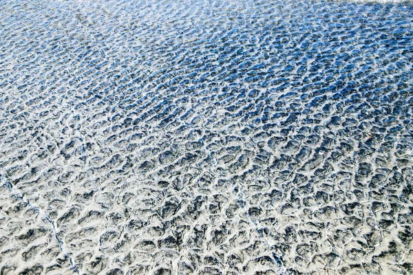 Ocean and beach. Water, ripples and reflections