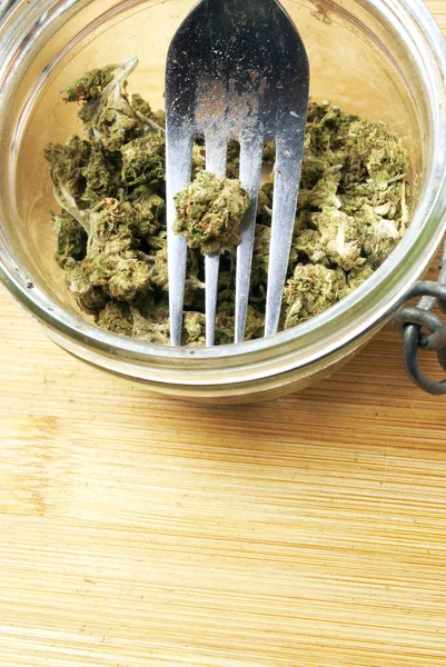 Close View Marijuana Glass Jar Metal Fork Wooden Background — Stock Photo, Image