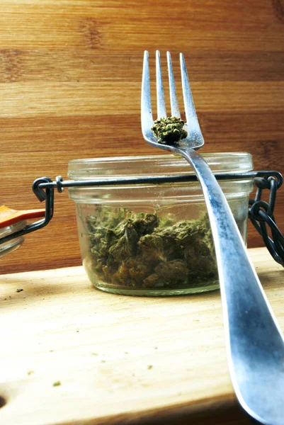 Close View Marijuana Glass Jar Metal Fork Wooden Background — Stock Photo, Image