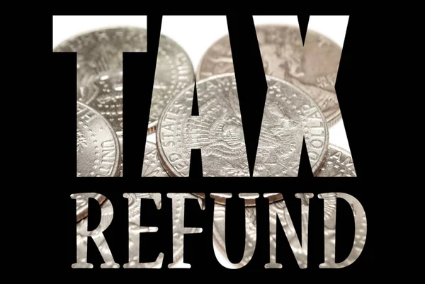 Tax refund inscription with coins inside on black background