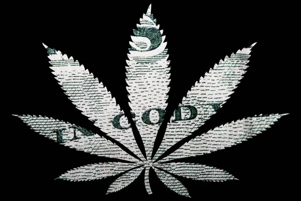 中にドル紙幣を持つマリファナ大麻の葉 — ストック写真