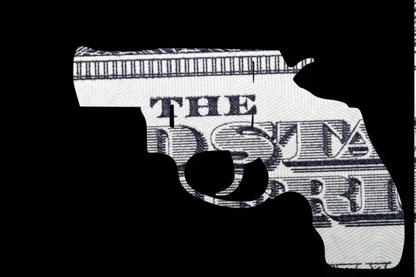 Gun and Money. Representing Shootings in America. Shape of Automatic Gun over detail of United States of America Dollar Bill