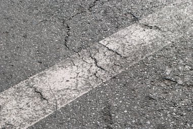 Işaretleri ile grungy dokulu yol yüzeyi