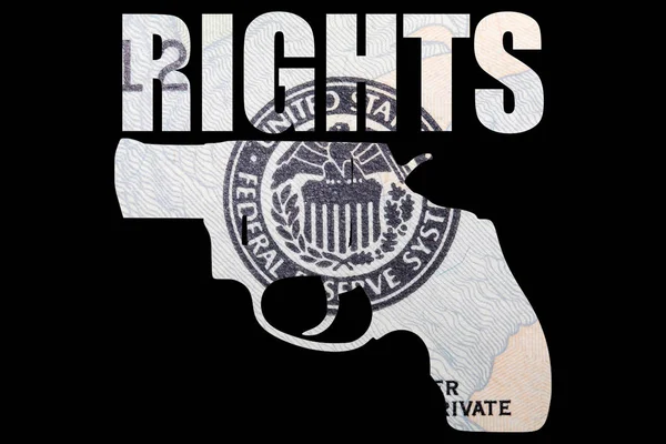 Gun with rights lettering, money on black background.