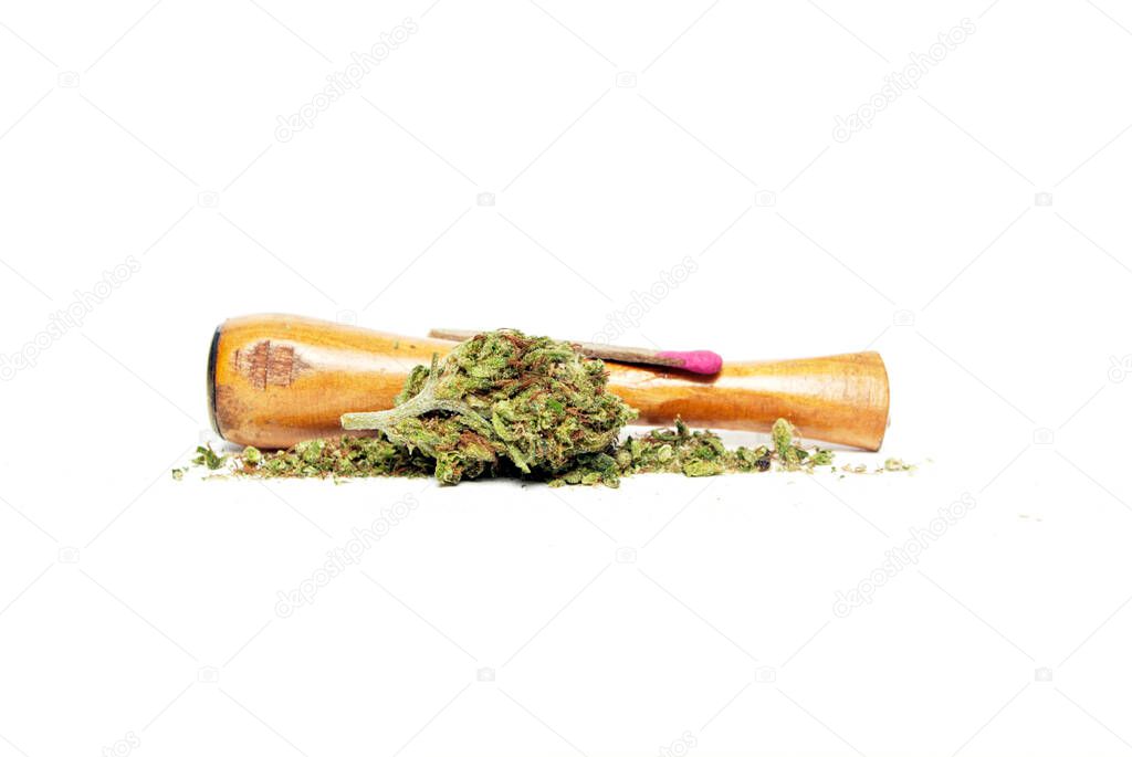 Marijuana and Cannabis Pipe on background