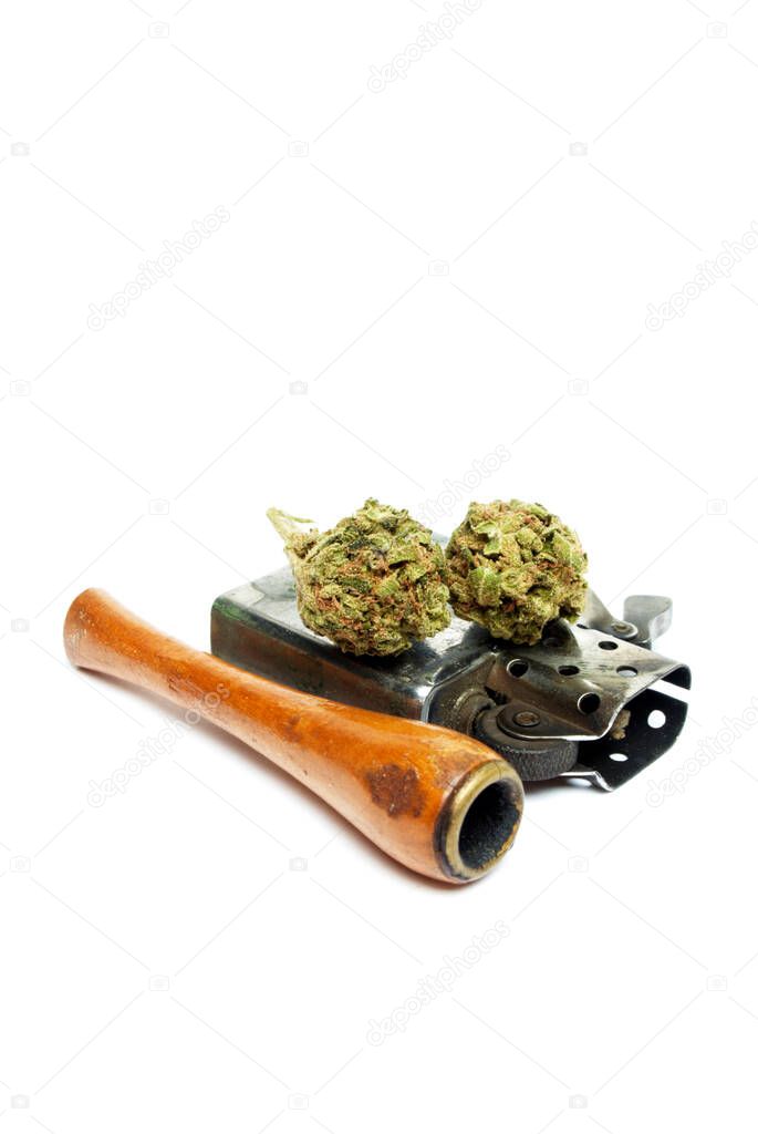 Marijuana and Cannabis Pipe on background