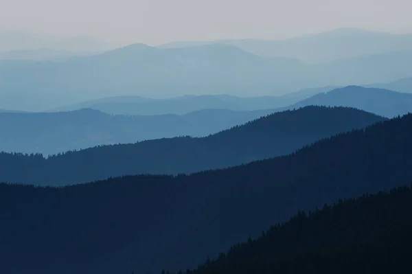 Blue nature background mountain silhouettes — Stock Photo, Image