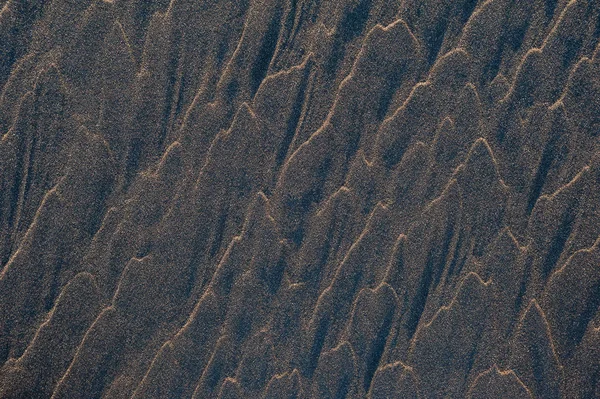 Black sand waves as background